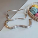 Banguotas užsegimas rankinėms